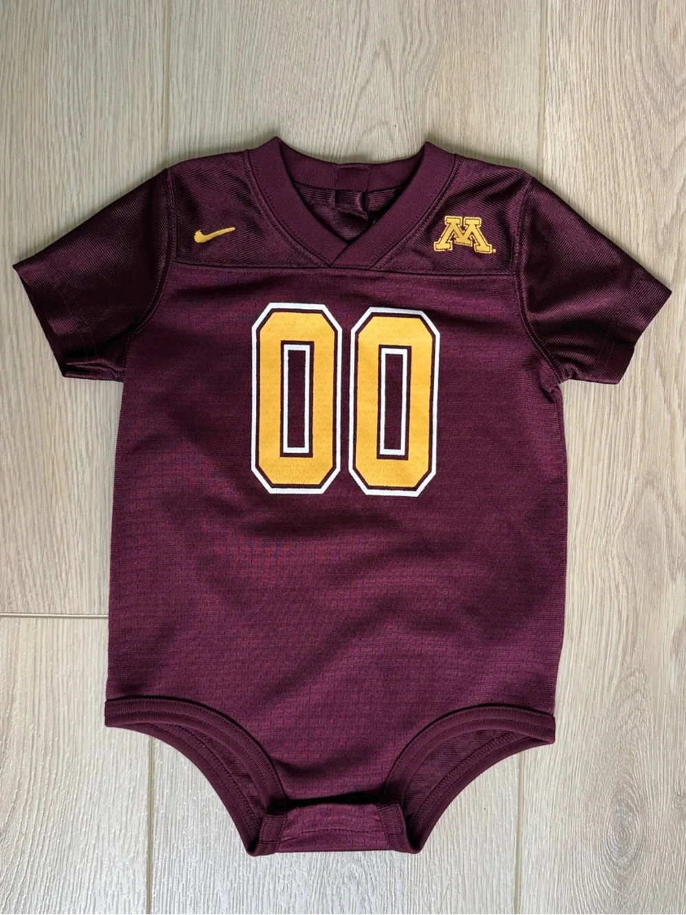 Nike Kids Maroon Bodysuit with Gold Detailing